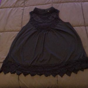 Navy sleeveless blouse with high neck, knit detail